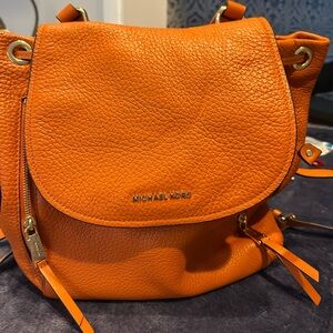 Michael Kors Orange Pebble Leather Women's backpack.